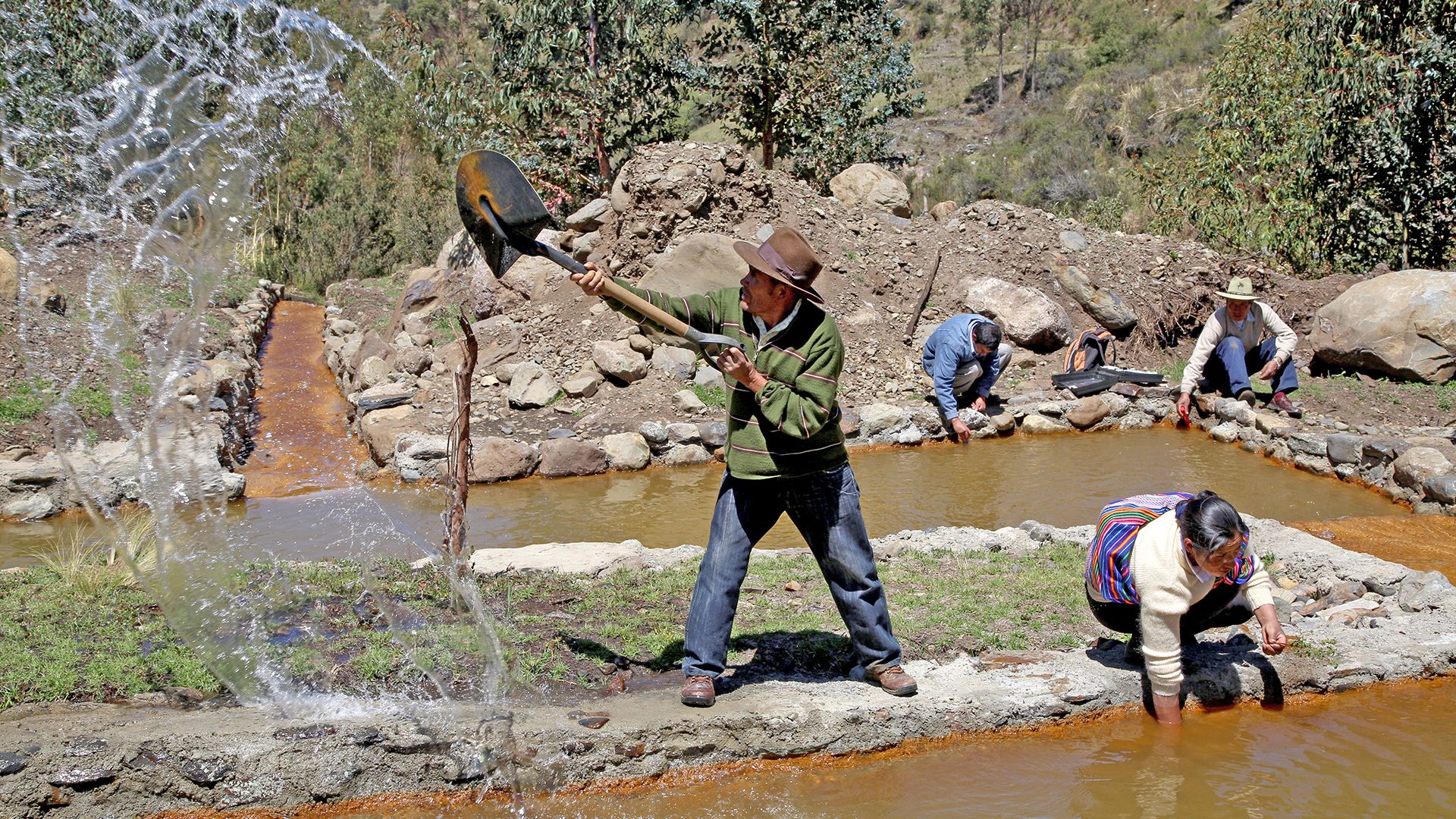 Farmers in Peru cleaning a canal which supplies them with river water