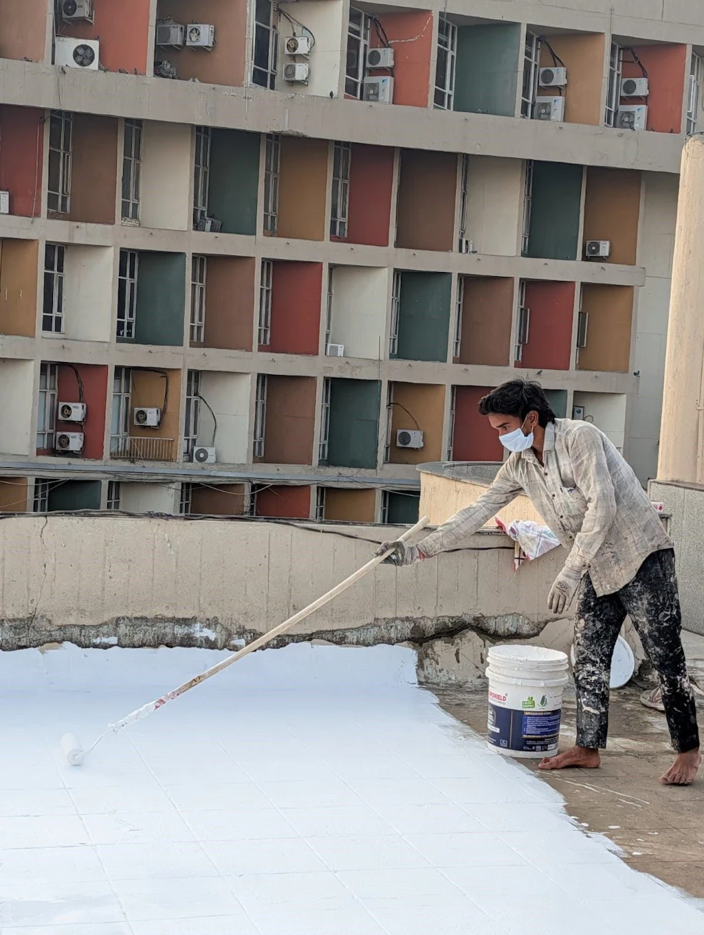 Roof painted white to increase solar reflectivity and reduce indoor heat gain in New Delhi, India